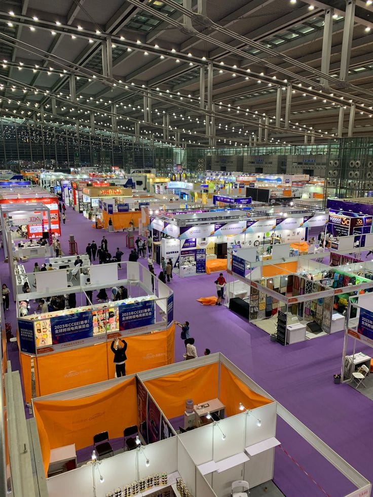 A large expo hall filled with rows of exhibitor stalls